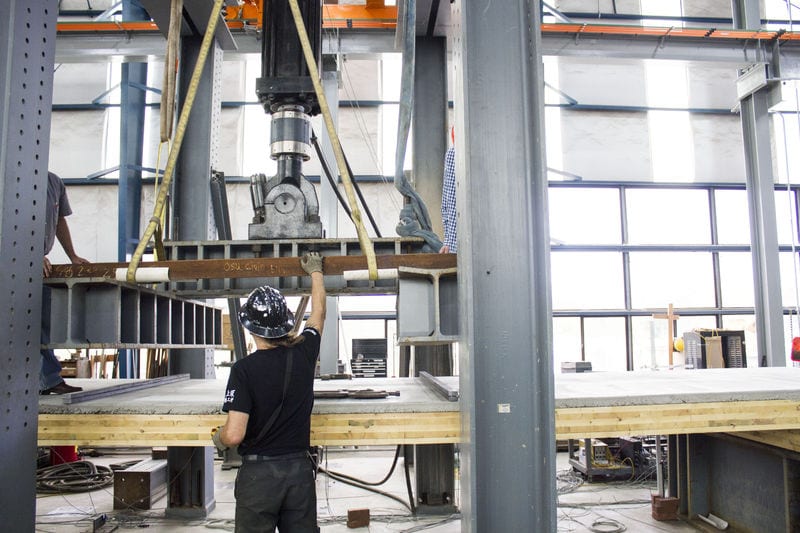 A person running a timber floor test